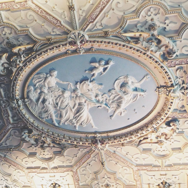 a ceiling mural depicts several angels on horses and chariots