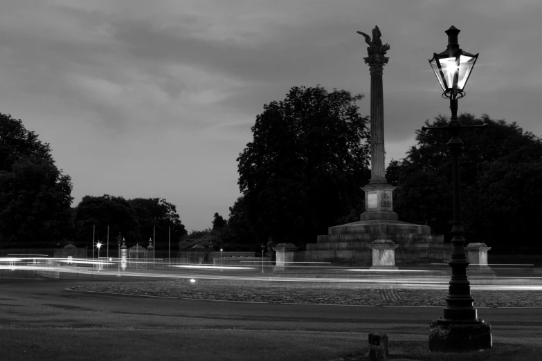 a street lamp with the streetlights on and street lights lit up