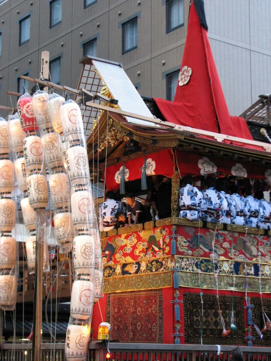 a small outdoor vendor sells candles and other craft items