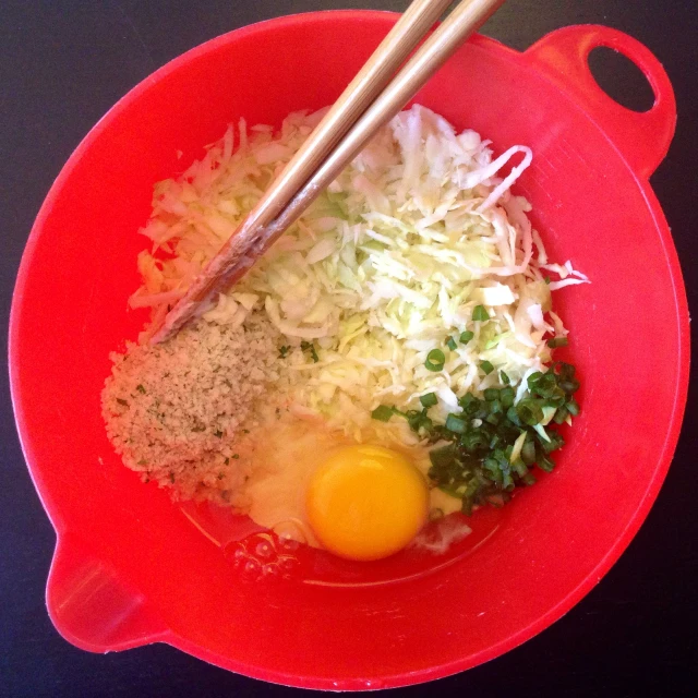 the bowl of rice and ingredients for stir fried eggs