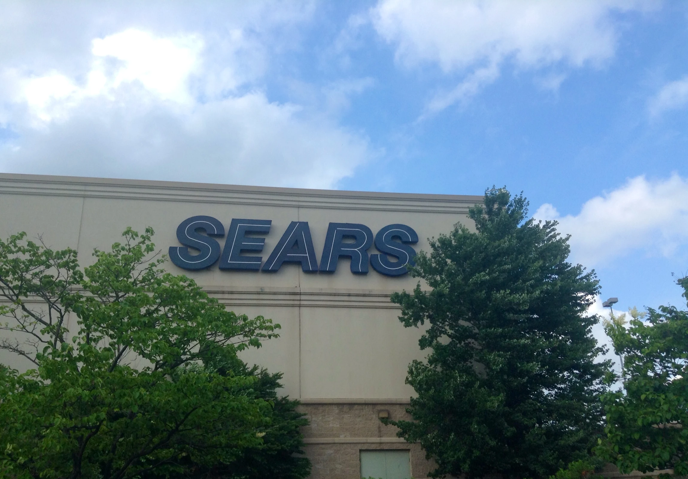 a store building that has the word sears on it