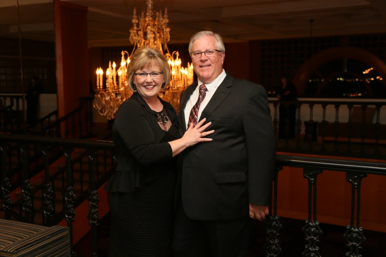 a man and woman smiling for a po