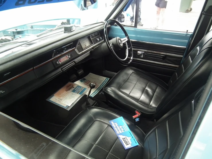 an interior of an older car with its sunroof