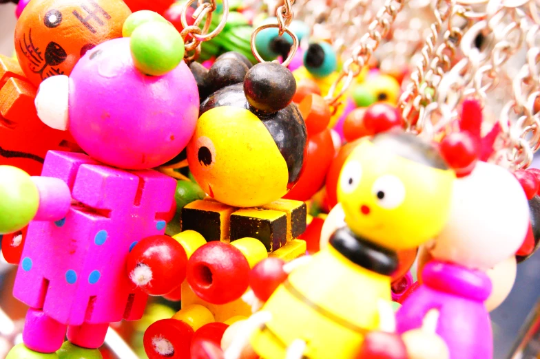 many different colorful toys have been made with little toy figures