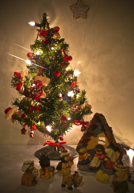 christmas tree decorated with a nativity scene and other items