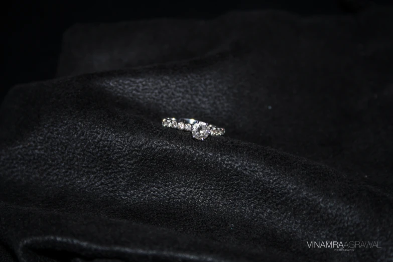 a ring on a black cloth with no background