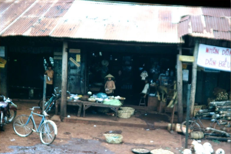 a picture of a dirt market with lots of produce