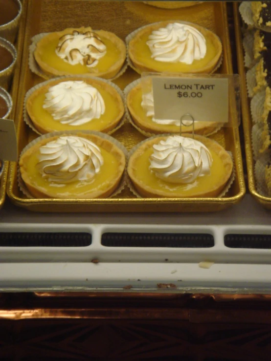 there are nine lemon tart pies in the case