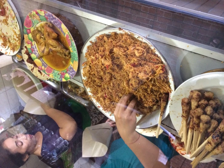 a buffet table with a long plate full of food