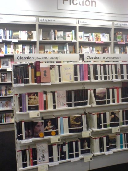 a number of books on shelves in a liry