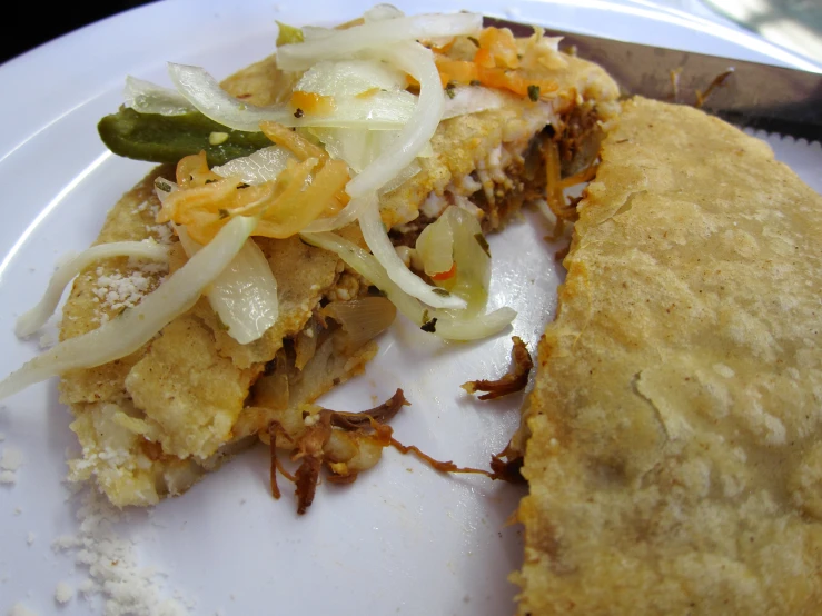 a close up view of a slice of food on a plate