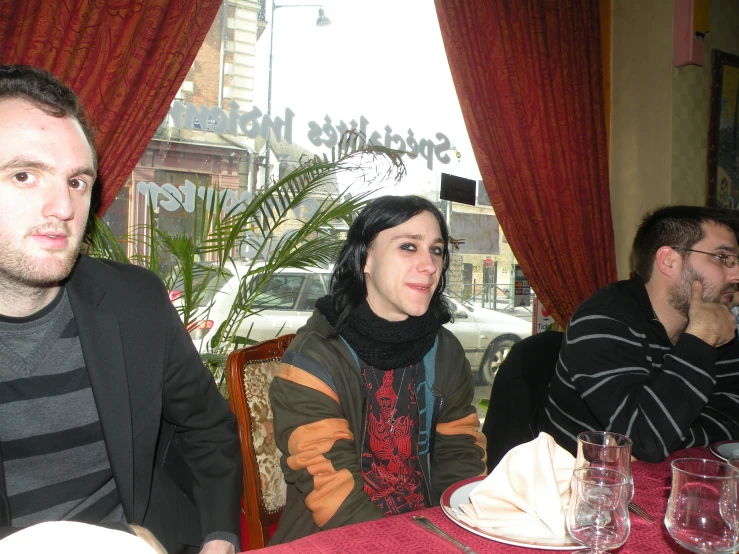 a group of people sitting around a table