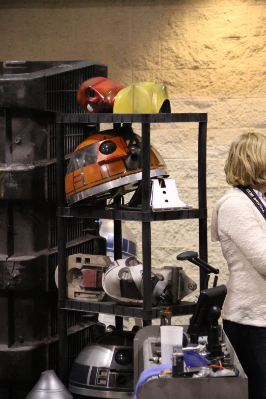 a woman walks by her car collection