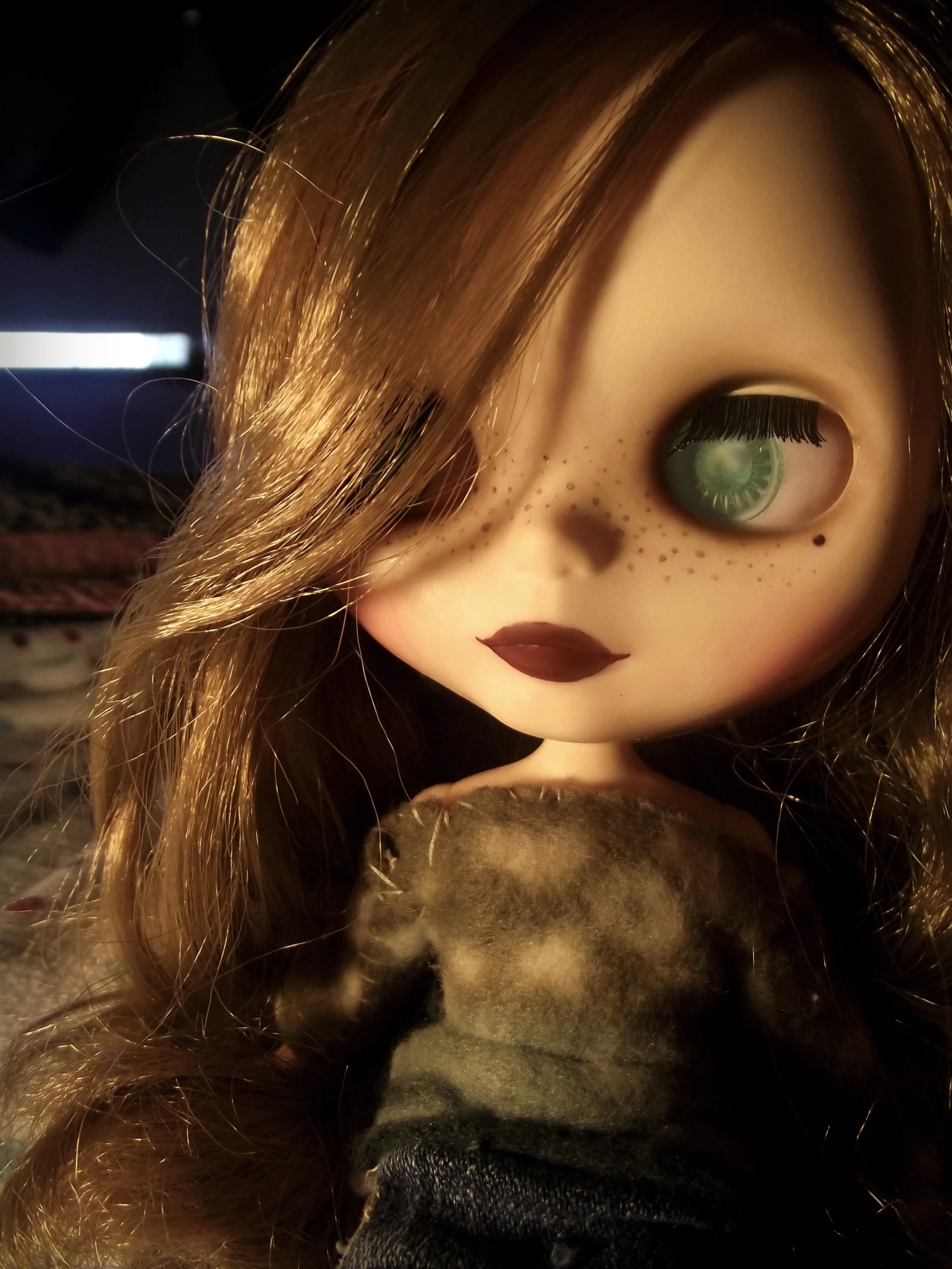 a close up of a doll with long hair