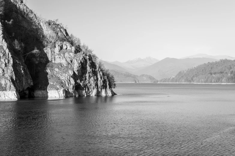 a boat is sailing in a still lake