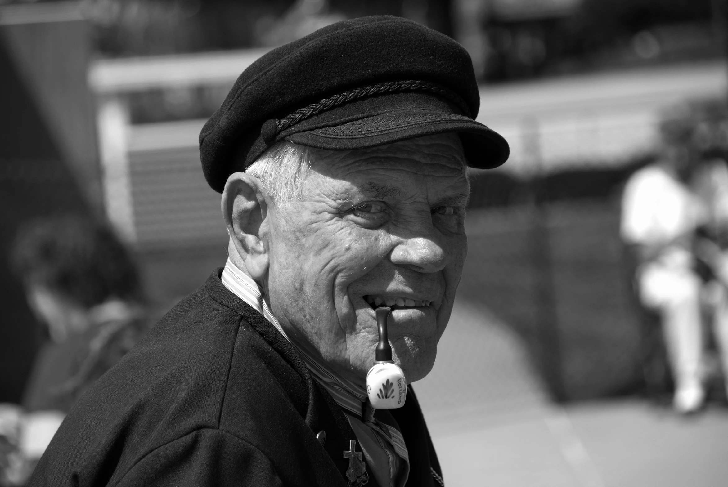 black and white pograph of an elderly man smoking