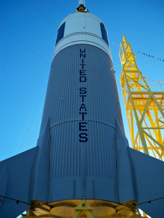 the saturn rocket is on display under a blue sky