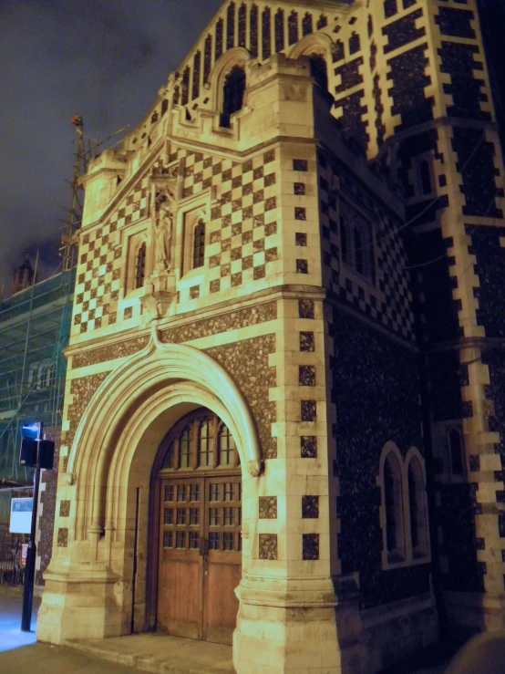 a brick building with a cross over entrance