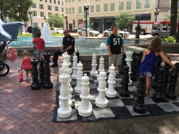 chess game with people playing on chess board