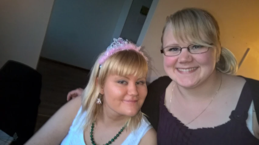 two women posing for the camera together