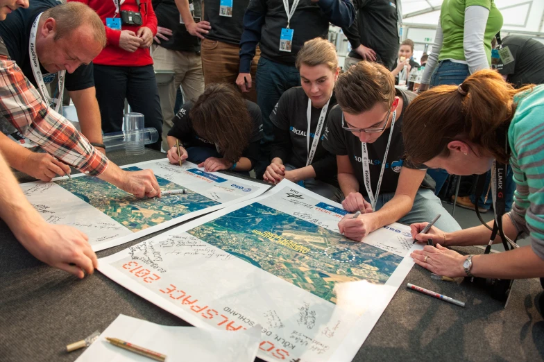 several people who are looking at a map