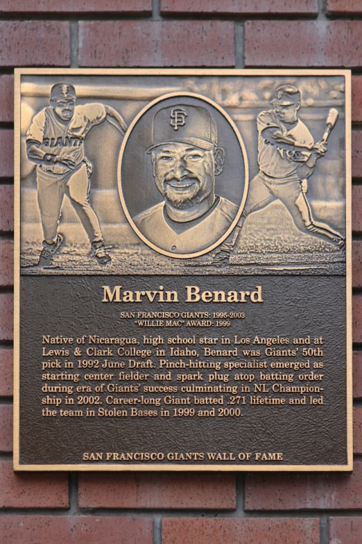 a plaque has a po of a baseball player on it