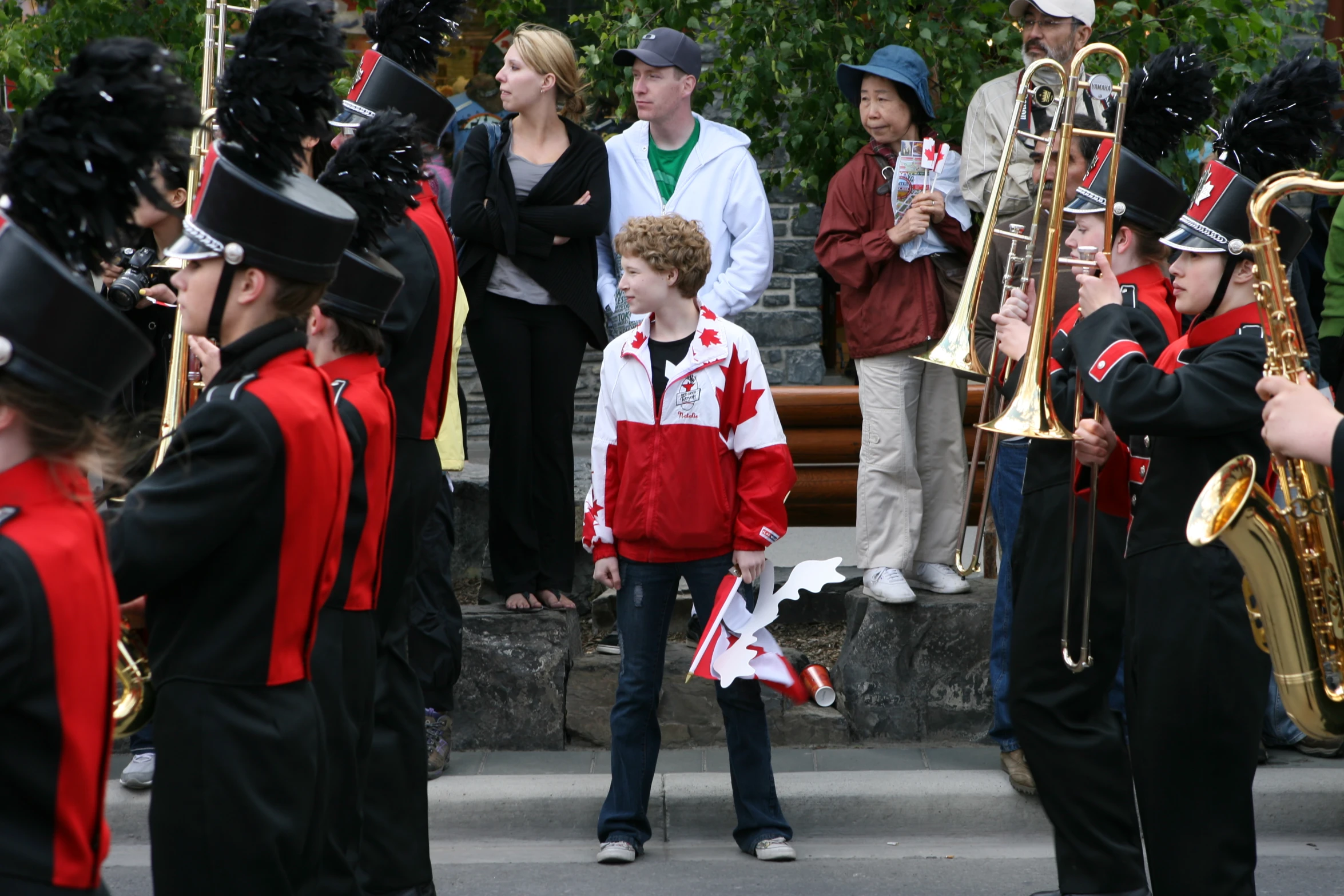 a group of people in costumes playing and standing around instruments