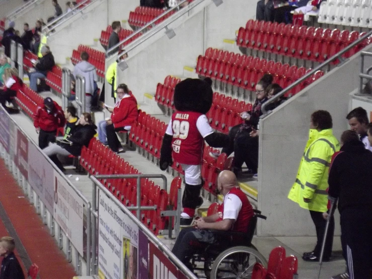 some fans dressed up like soldiers and a man in a wheel chair