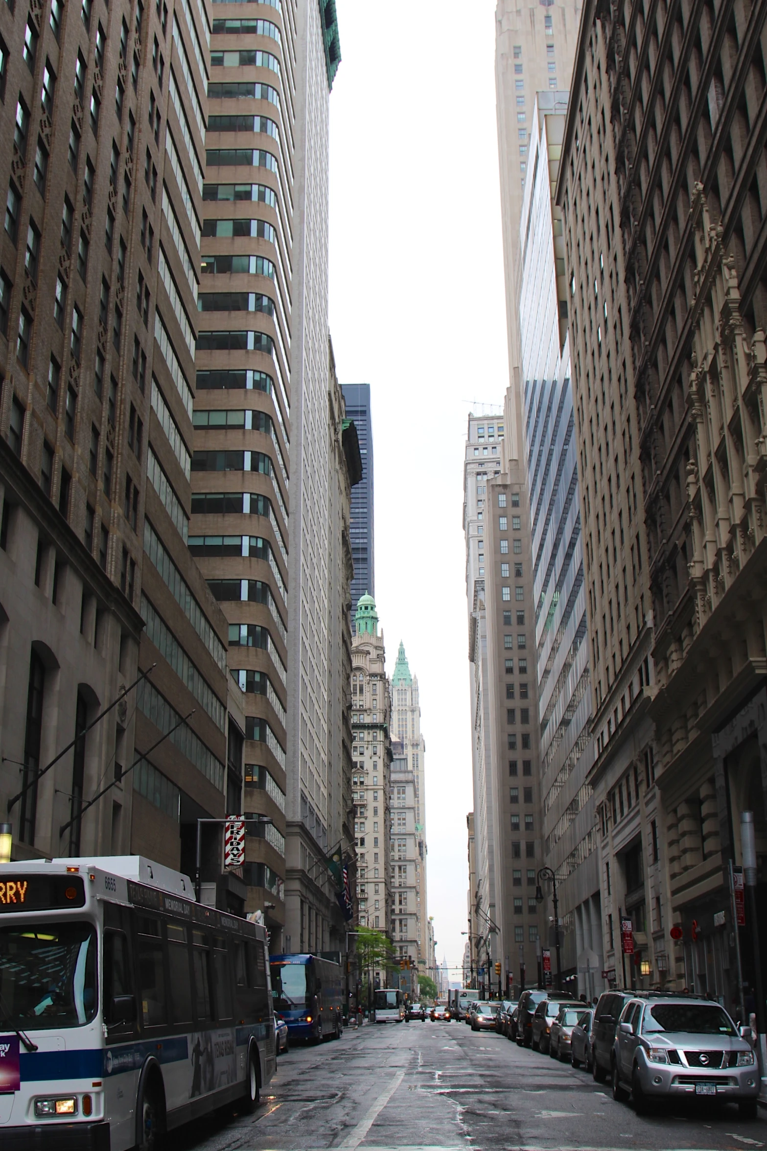 a bus is parked on the side of the road in the city