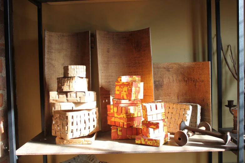 a shelf with some kind of stacks and a box