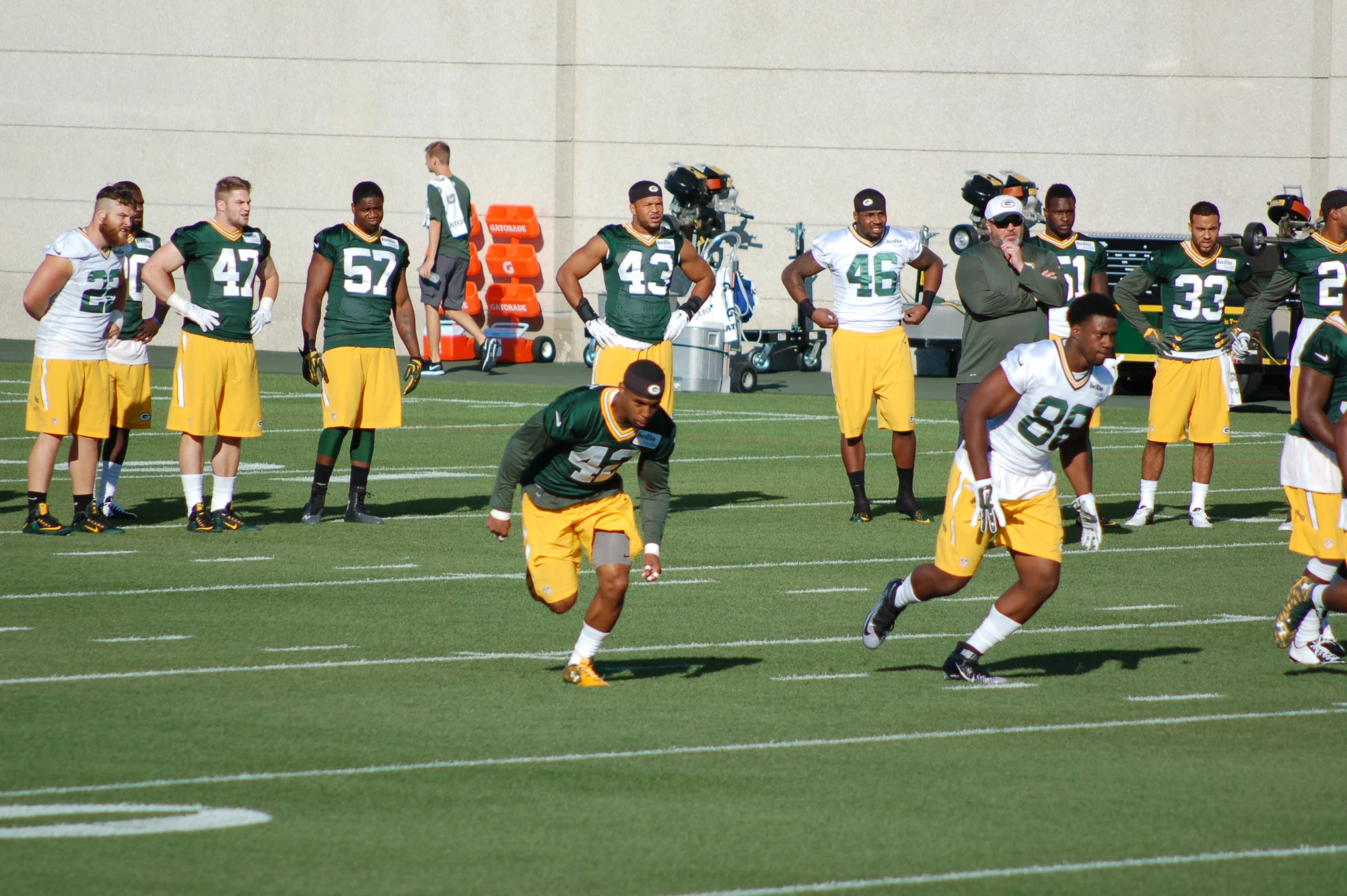 a football player running on the field for a team po