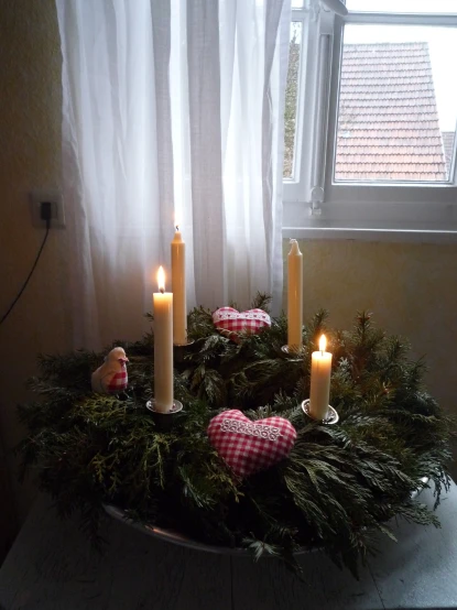 a table with a candle and decorations in it