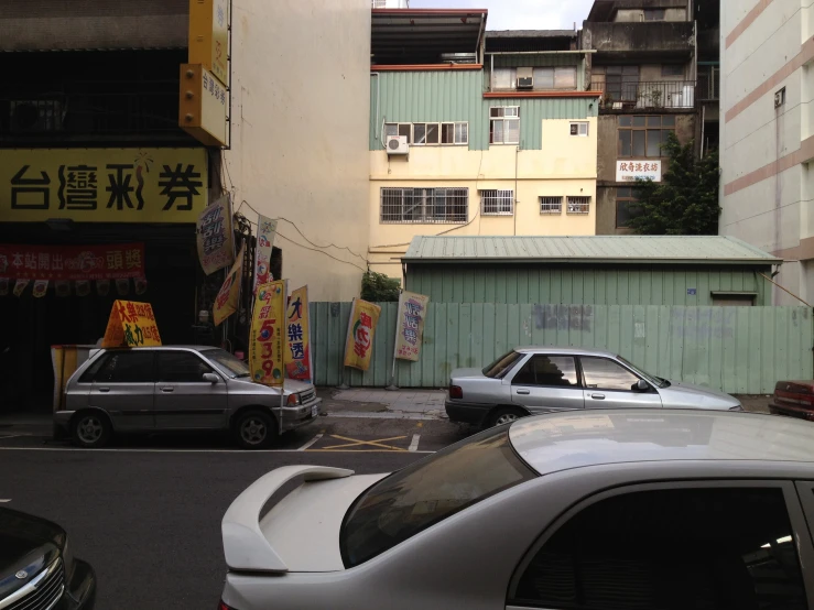 a couple of cars that are parked in the street