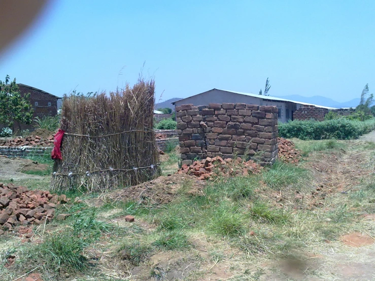 the building is constructed of bricks with some wire