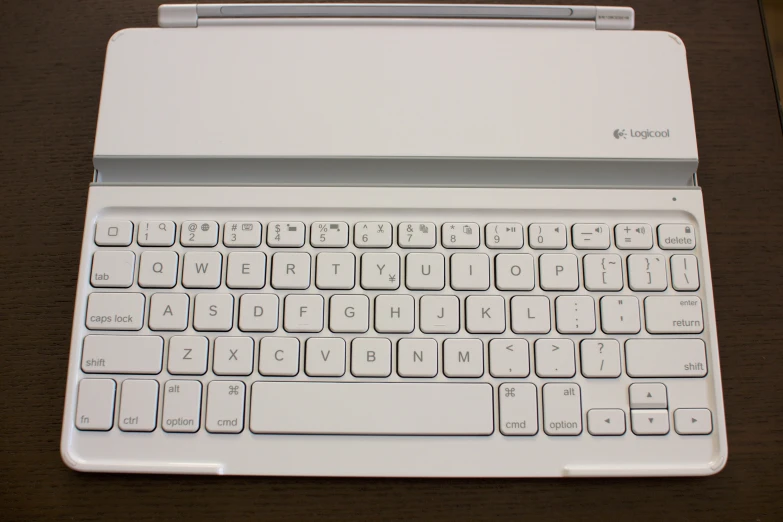 a small white keyboard on top of a laptop