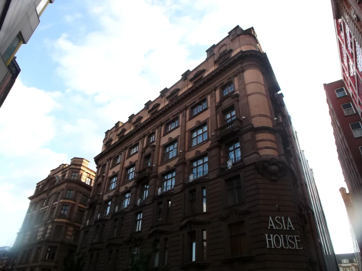 a large building with windows and many different buildings