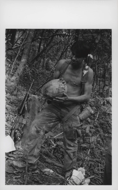 a man carries soing through the woods