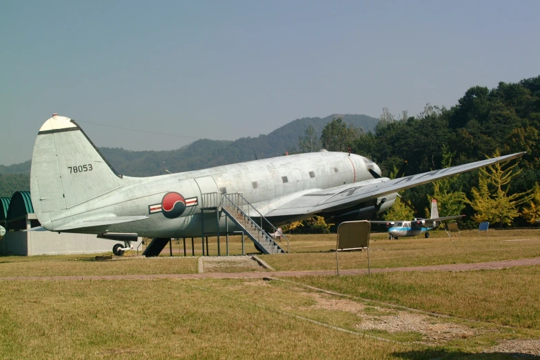 a plane sitting in the middle of a field