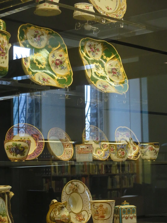 a collection of fancy, hand made plates is displayed