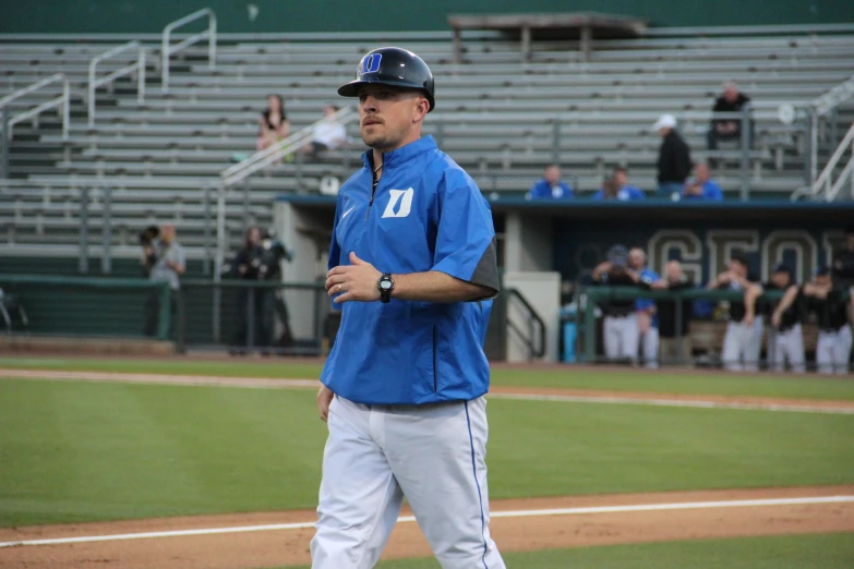 a baseball player standing on the field during a game