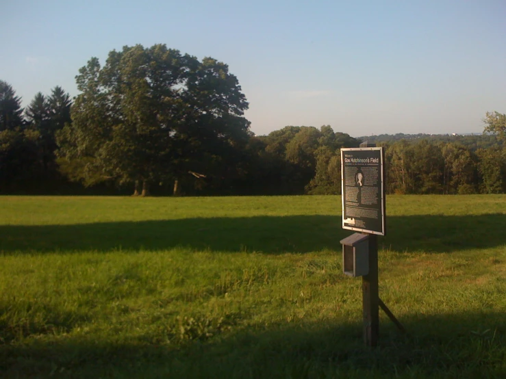 a sign in a field that is empty