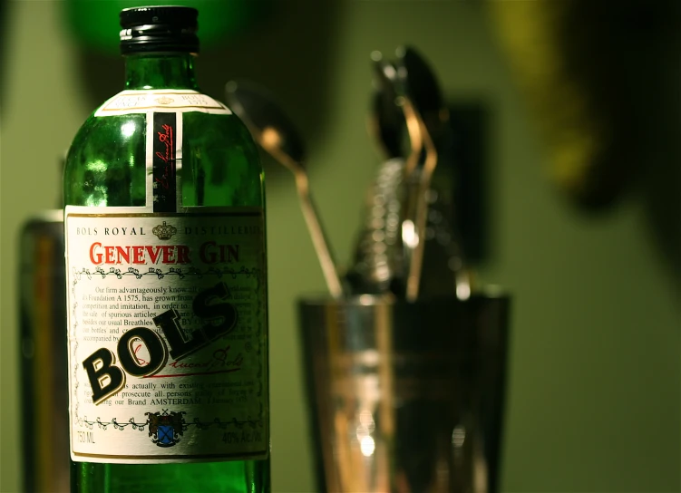 a green glass and a bottle of ginnyver