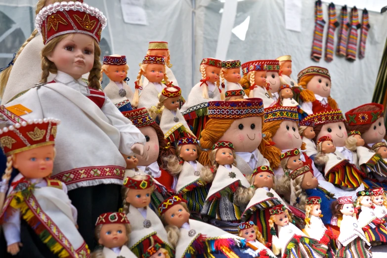 a number of dolls with different costume and colors