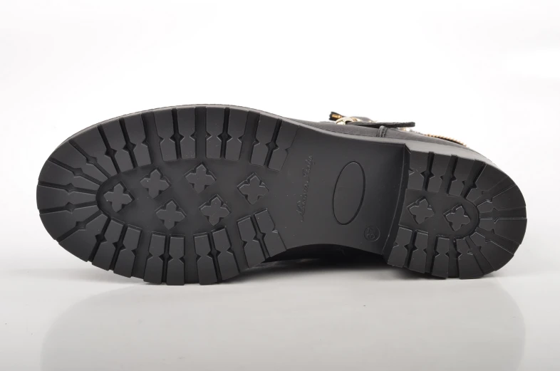 the bottom of a shoe showing an area for text