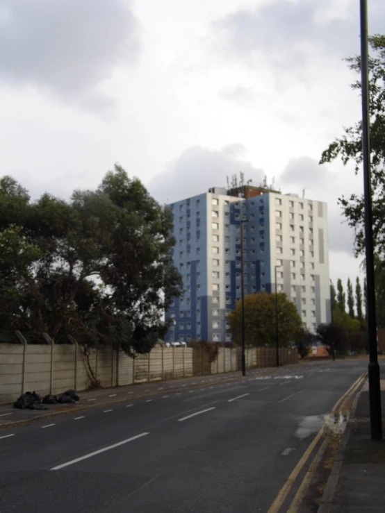 a large white building sitting next to a street