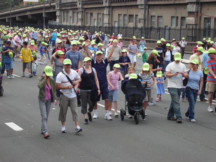 the people are walking together down the road