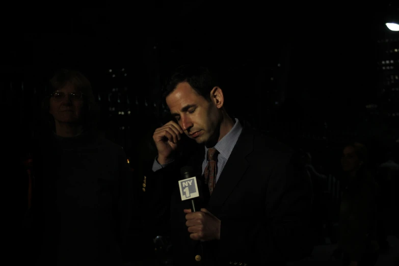 a man standing in front of a microphone