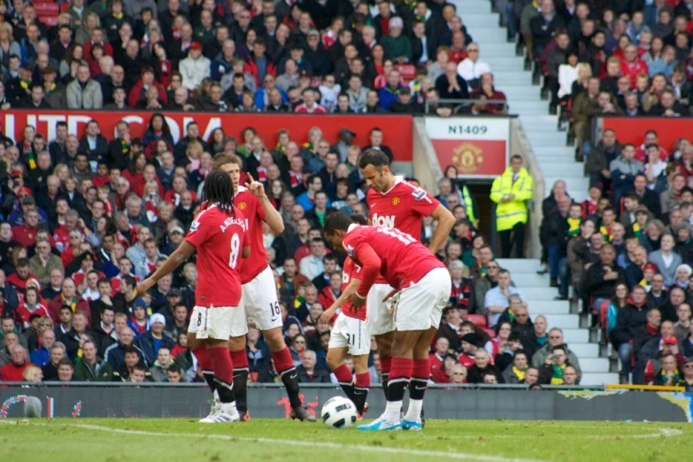 the soccer players are all playing together on the field