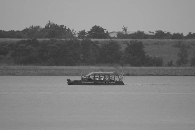 a small boat traveling across a large body of water