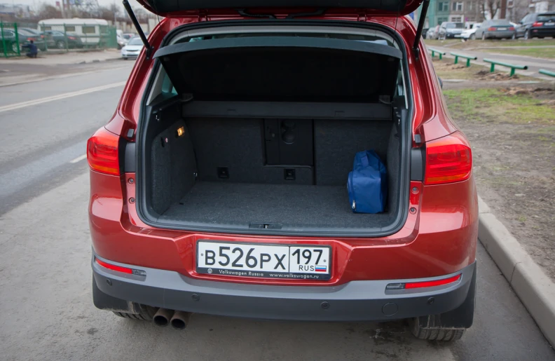 a small hatchback is opened to reveal the trunk